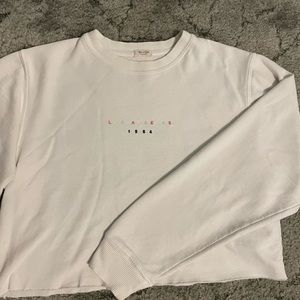 White, long sleeve, crop top, Los Angeles crew neck sweater.